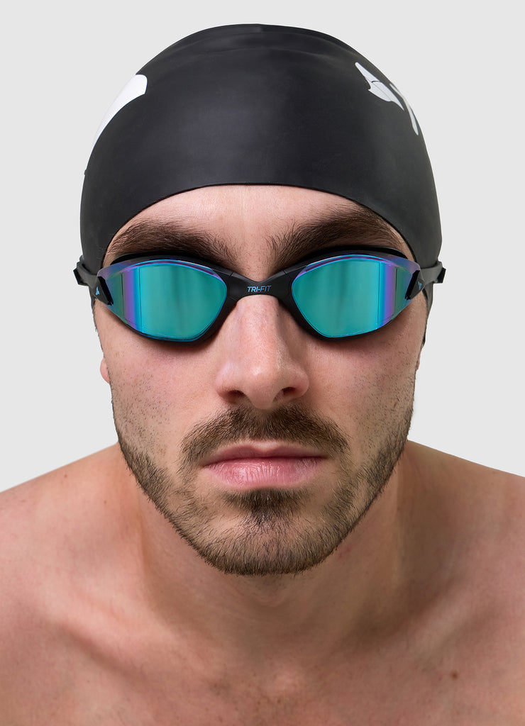 Man wearing TRI-FIT PROPEL Goggles and Black Swim Cap.