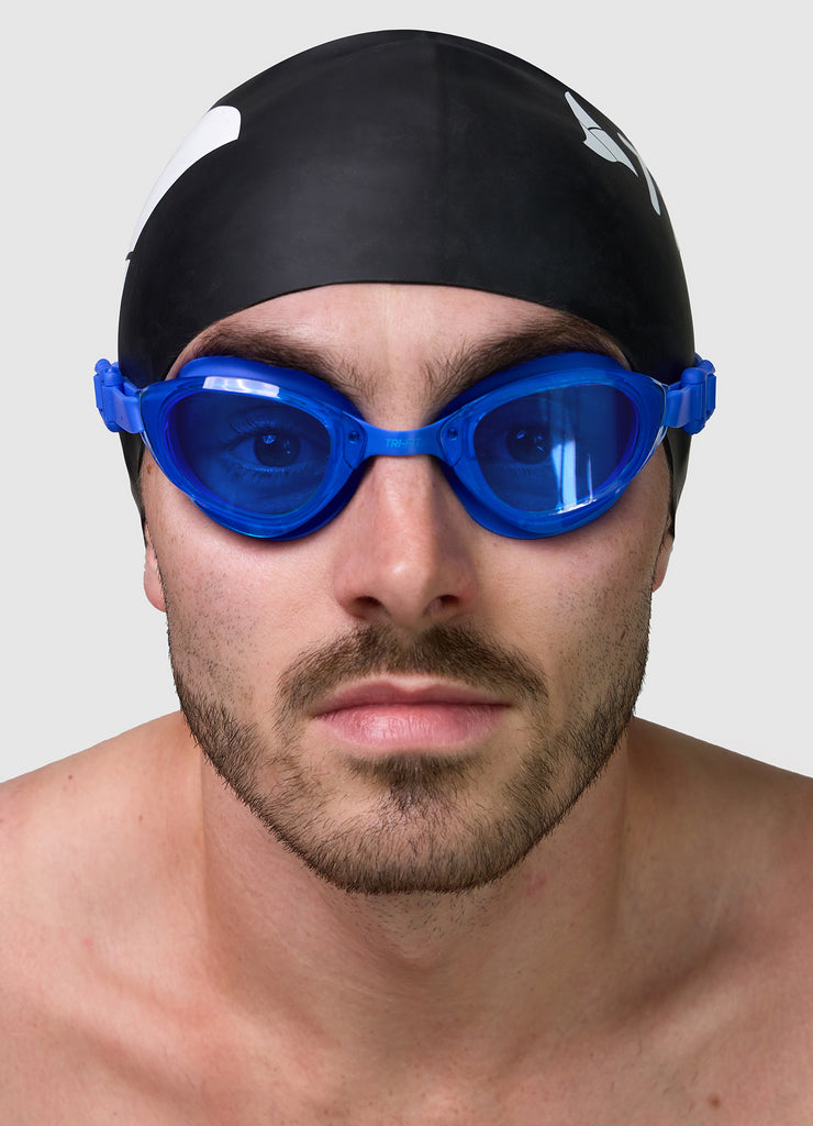 Male wearing TRI-FIT VOLT BLUE swimming goggles.