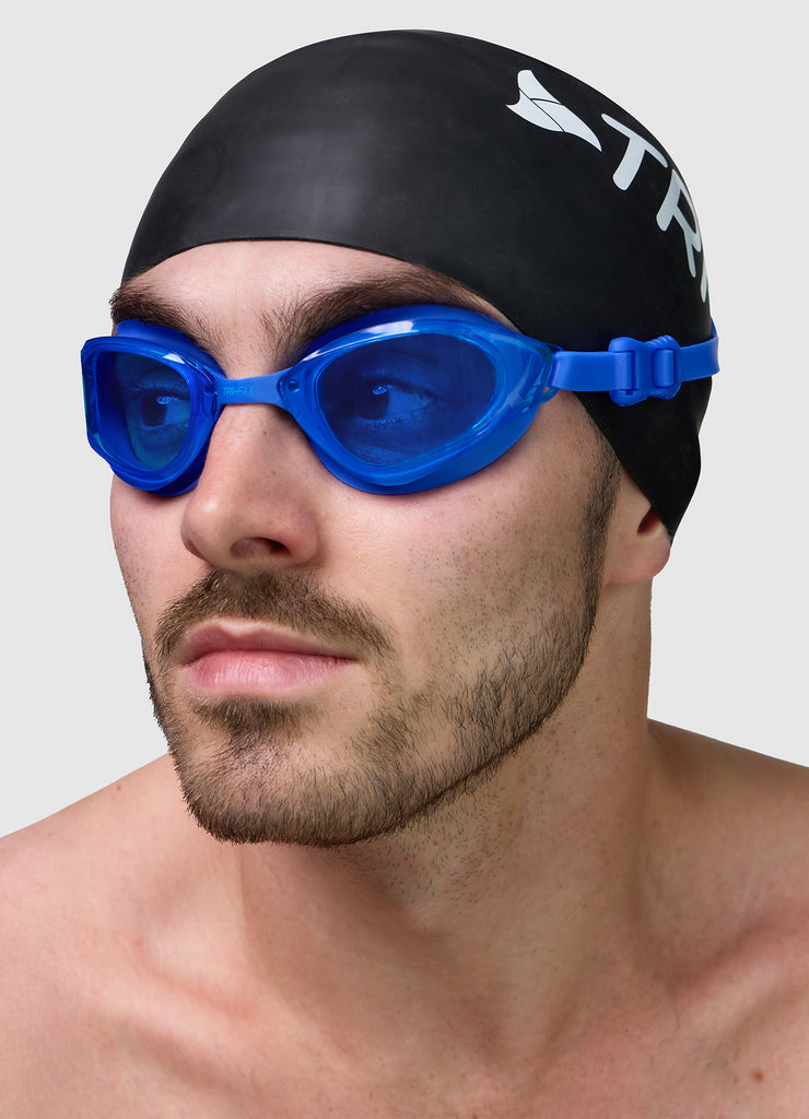 Male wearing TRI-FIT VOLT BLUE swimming goggles.