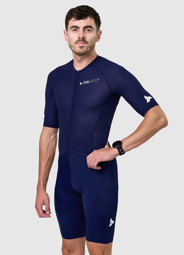Side profile of men’s VANGUARD tri-suit in navy, showing ergonomic fit and full-body construction