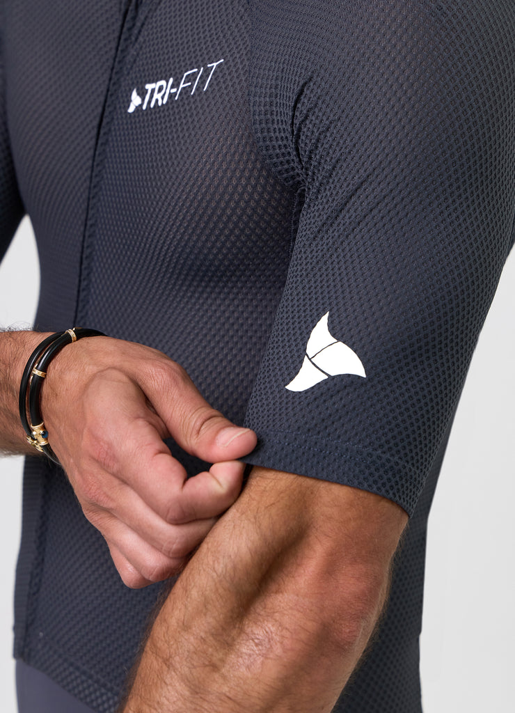 White TRI-FIT logo printed on grey mesh sleeve of VANGUARD tri-suit, with laser-cut hem