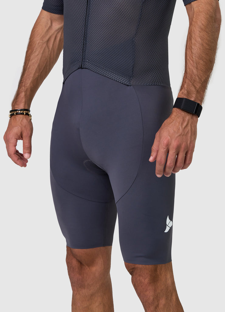 Side profile of men’s VANGUARD tri-suit in grey, showing ergonomic fit and full-body construction
