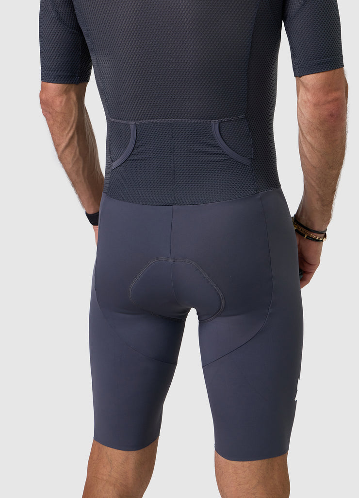 Back view of men’s VANGUARD tri-suit in grey, showing dual rear pockets and anatomical panel layout