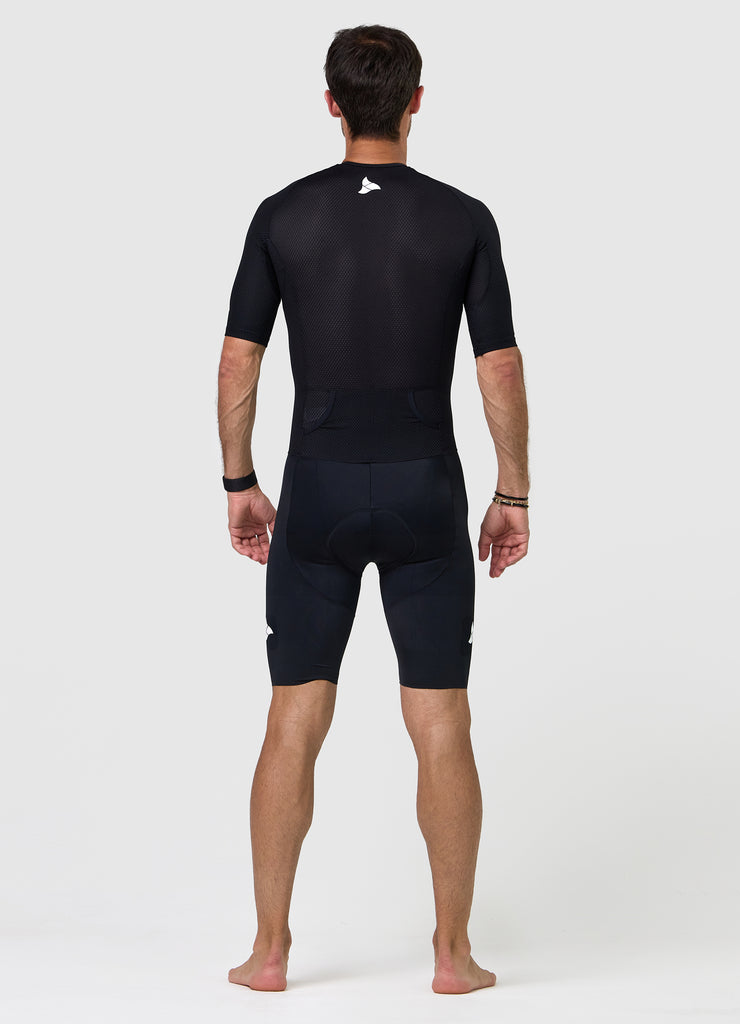 Back view of men’s VANGUARD tri-suit in black, showing dual rear pockets and anatomical panel layout