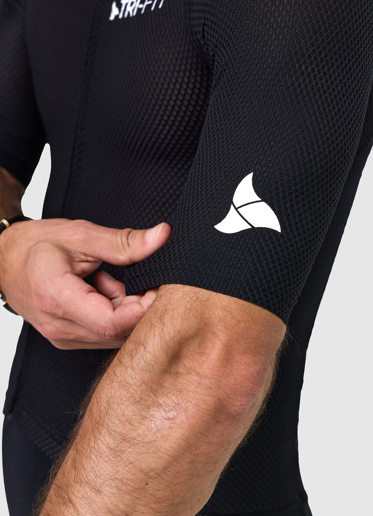 White TRI-FIT logo printed on black mesh sleeve of VANGUARD tri-suit, with laser-cut hem