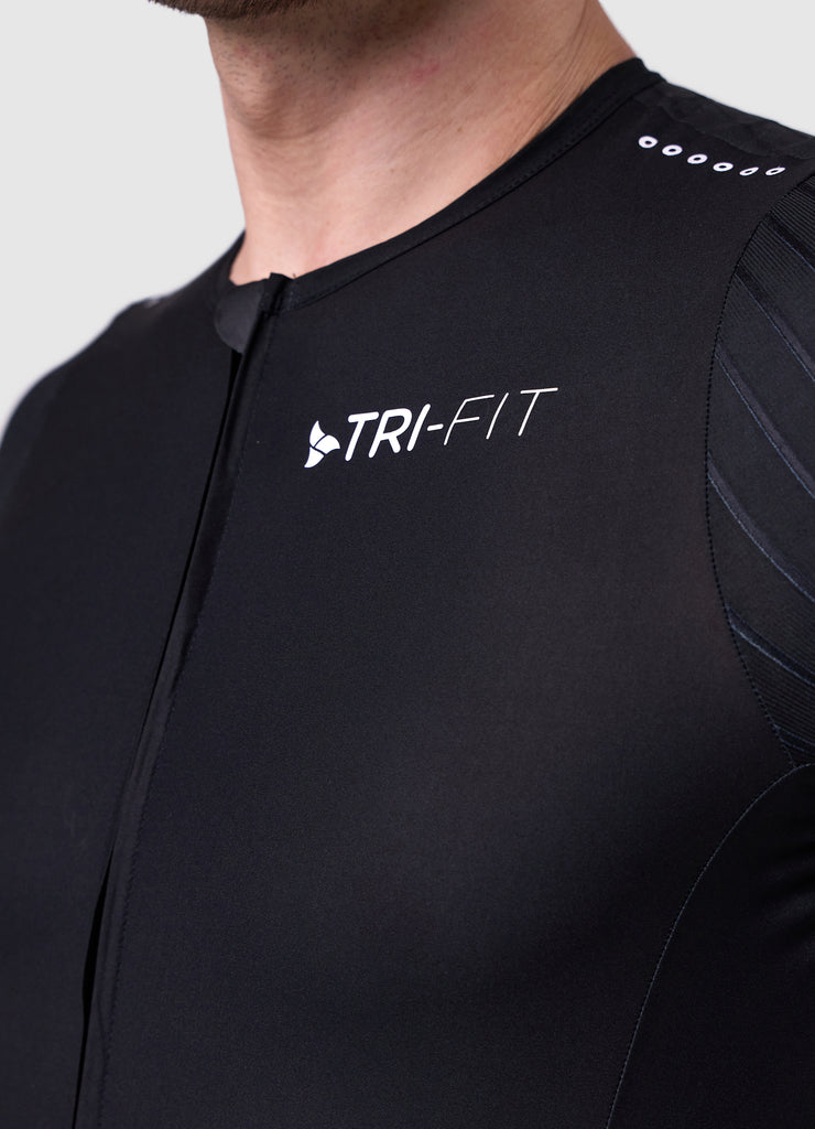 Close-up of the ribbed aero sleeve with TRI-FIT logo and laser cut shoulder ventilation on the white/black VORTEX triathlon suit
