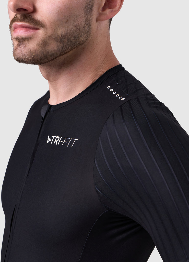 Close-up of the ribbed aero sleeve with TRI-FIT logo and laser cut shoulder ventilation on the white/black VORTEX triathlon suit