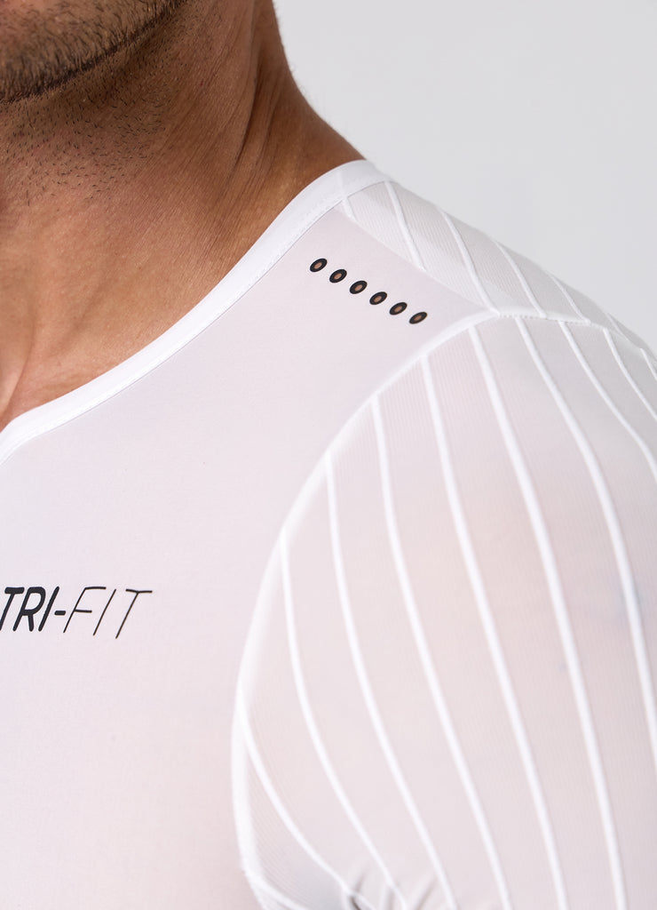Close-up of the ribbed aero sleeve with TRI-FIT logo and laser cut shoulder ventilation on the white/black VORTEX triathlon suit