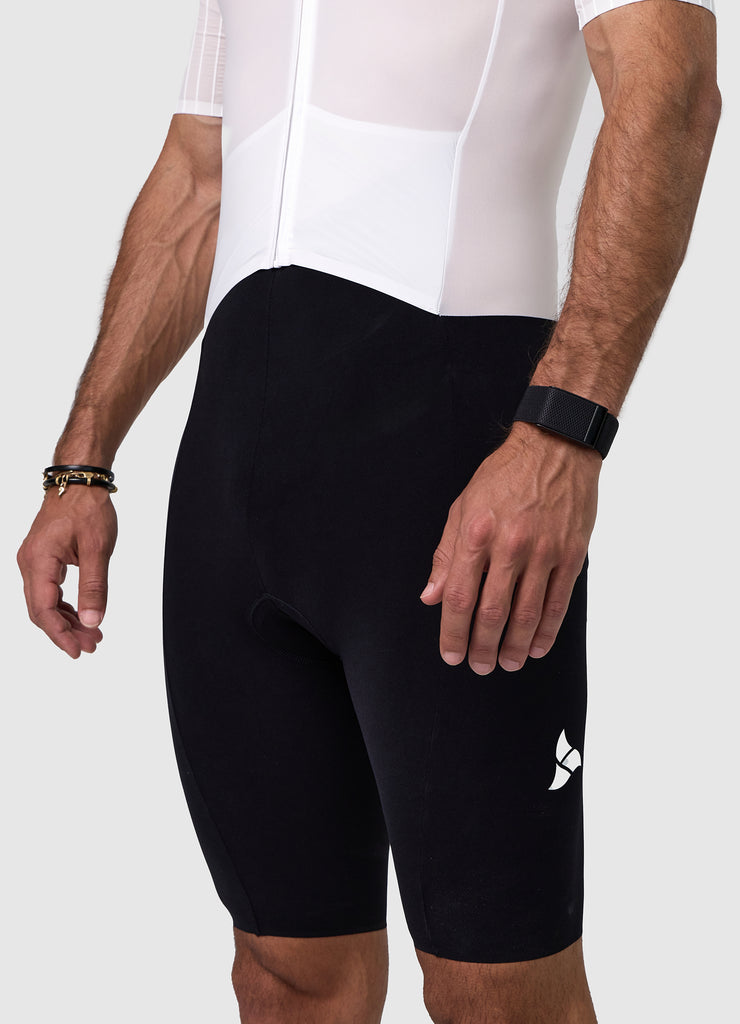 Side view of the men's white/black VORTEX triathlon suit showcasing aero sleeves and race cut