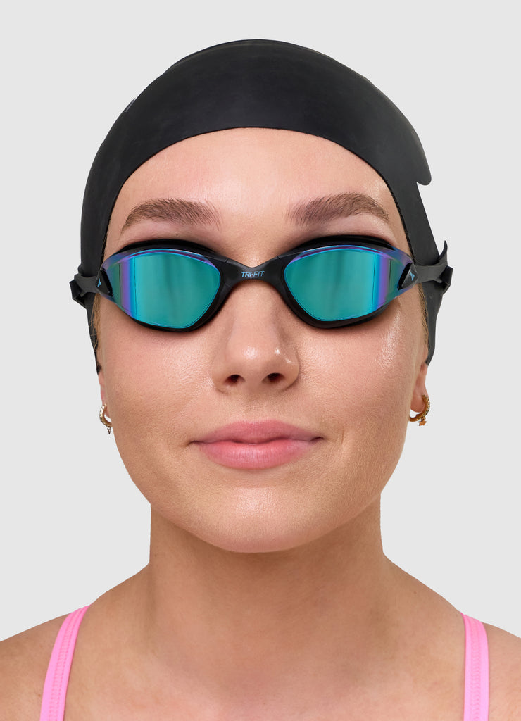 Women wearing TRI-FIT PROPEL Reversible Swimsuit with PROPEL Goggles and Swim Cap.