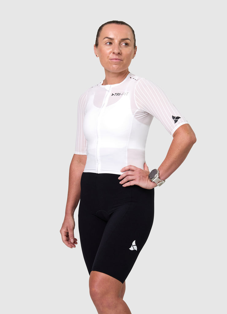Side view of the women's white/black VORTEX triathlon suit showing aerodynamic sleeves and fit