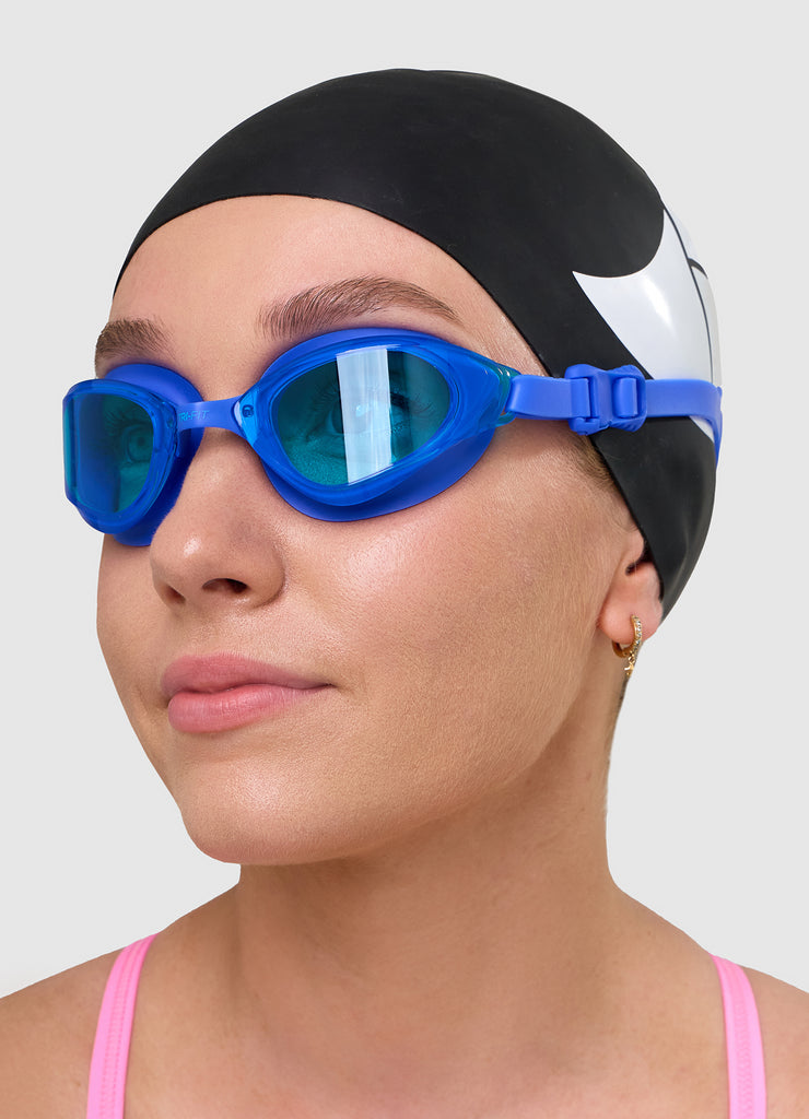 Female wearing TRI-FIT VOLT BLUE swimming goggles.
