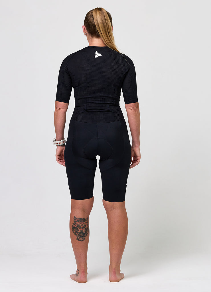 Back view of TRI-FIT VANGUARD tri-suit in black showing large aerodynamic pockets and shaped rear panel
