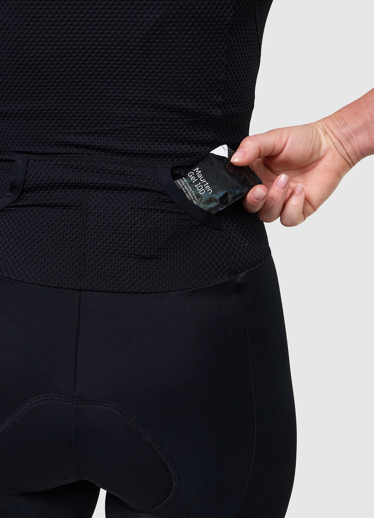 Close-up of rear pocket opening and internal stitching on VANGUARD tri-suit in plum