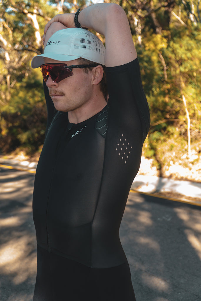 Man wearing TRI-FIT VORTEX tri-suit. Underarm laser cut ventilation.