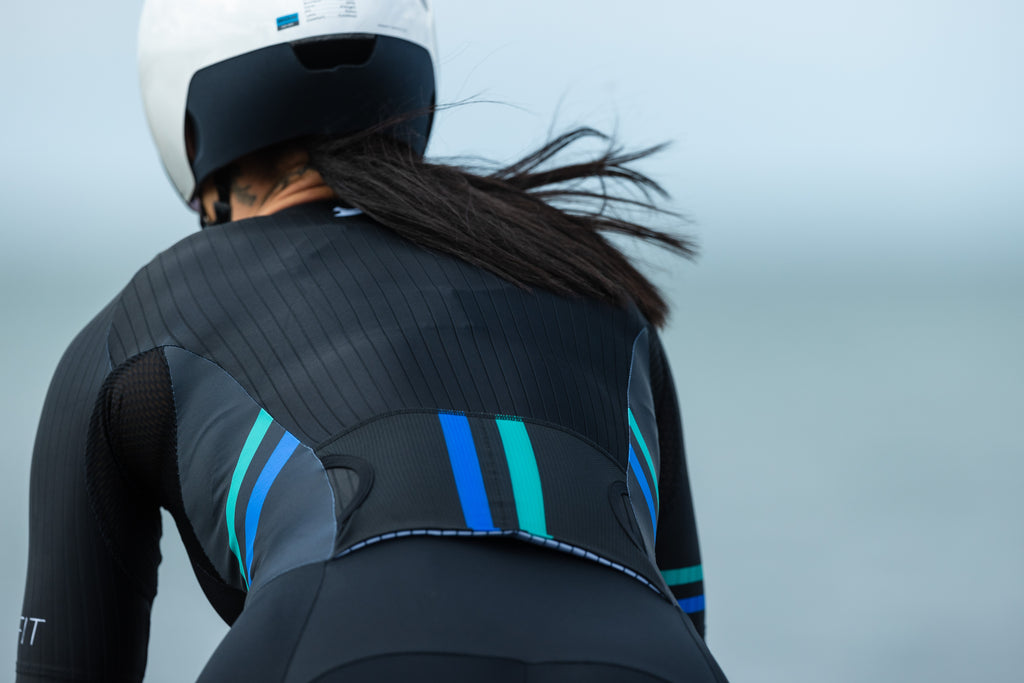 Female wearing the black EVO women's suit cycling