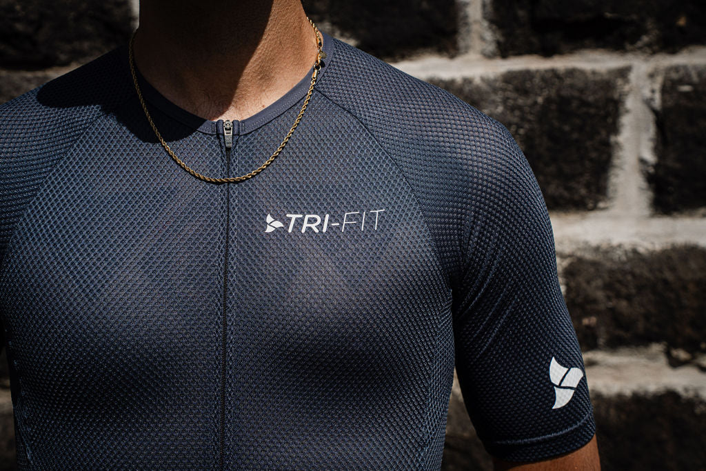 Man running wearing VANGUARD DARK GREY tri-suit. 220 triathlon best on test. 