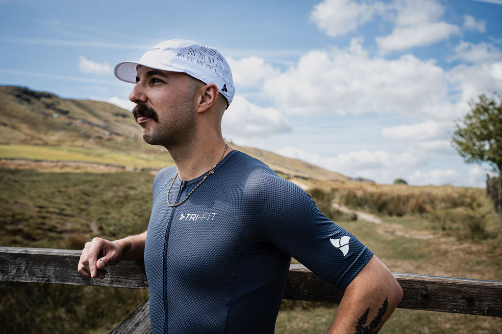 Man running wearing VANGUARD DARK GREY tri-suit. 220 triathlon best on test. 