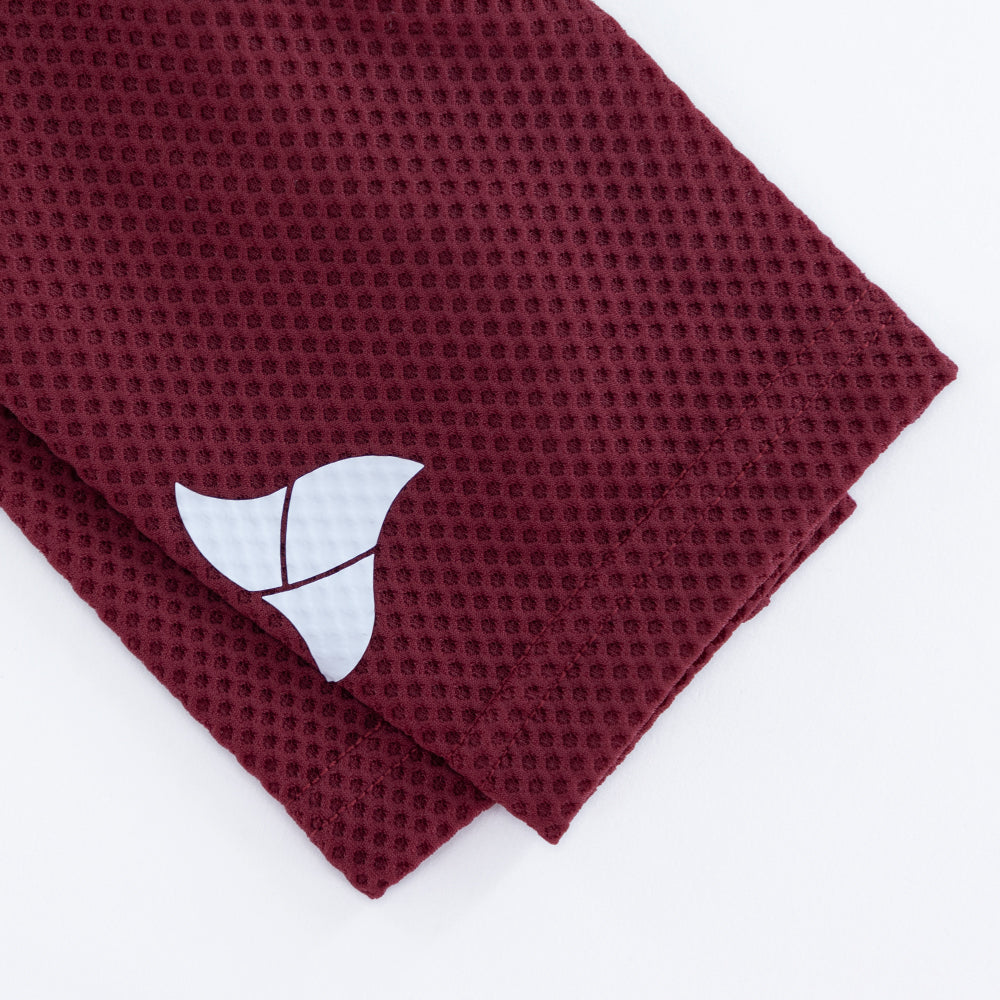 TRI-FIT logo printed on sleeve of VANGUARD tri-suit in wine red, showing laser-cut finish