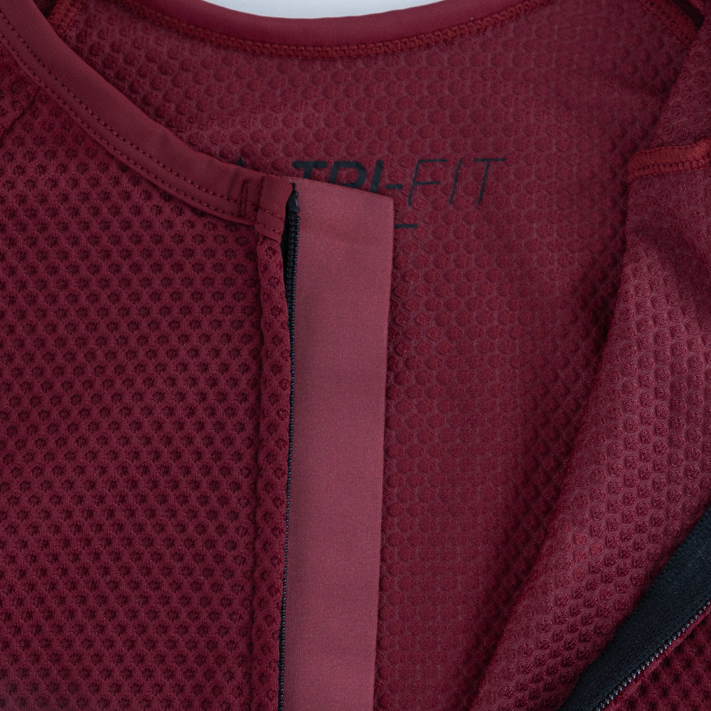 Close-up of TRI-FIT VANGUARD tri-suit neckline showing breathable mesh fabric and internal zipper construction