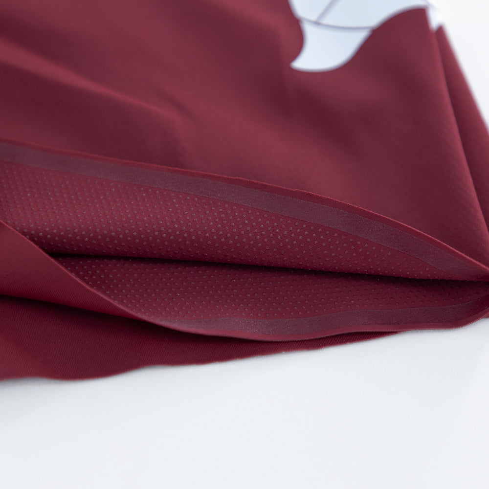 Close-up of printed silicone dot grippers on inner leg hem of VANGUARD tri-suit
